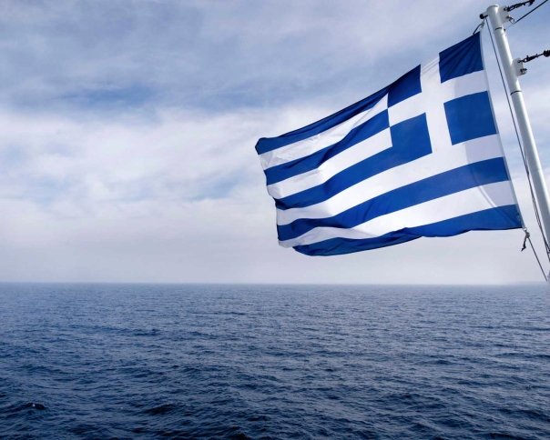 Greek Flag Flying from the back of a Blue Star Ferry